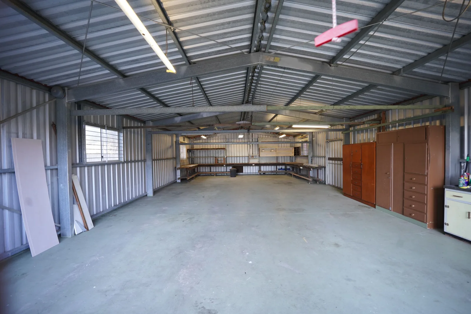 Vacant commercial workspace ready for turnover repairs and preparation.